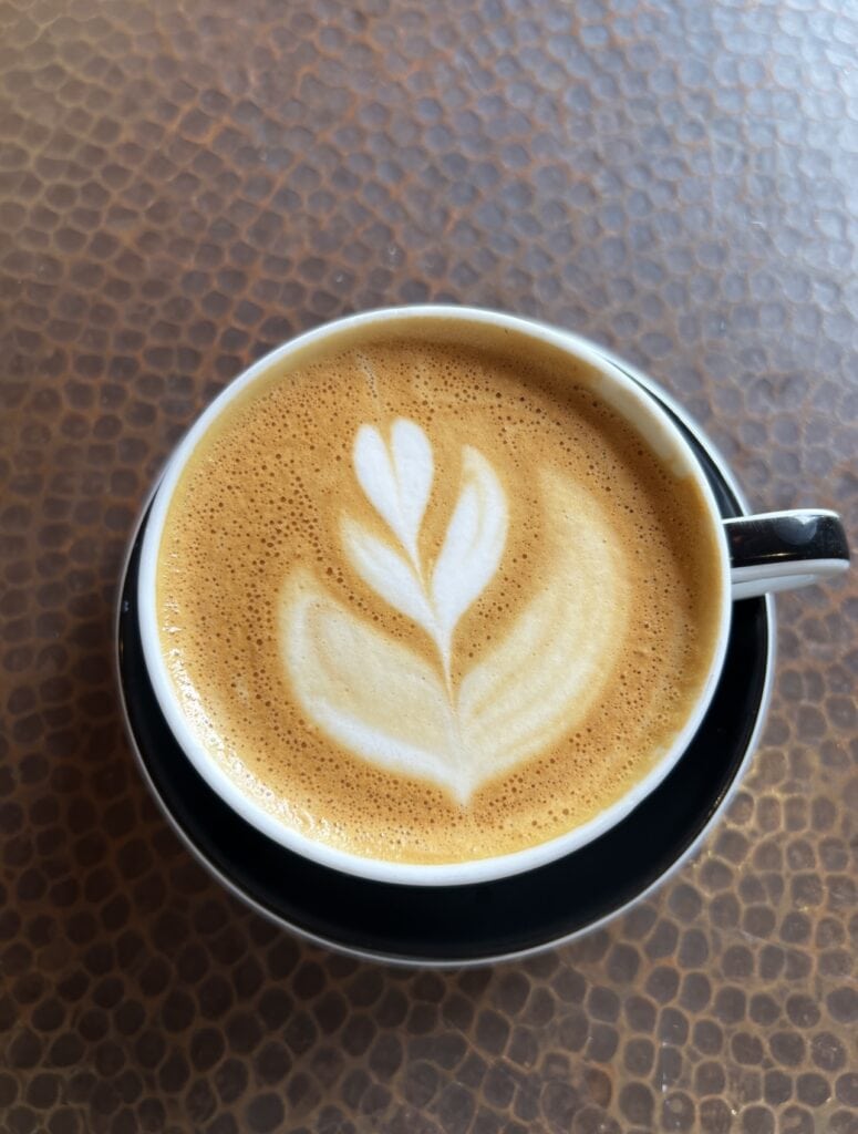 cup of coffee with latte art cup of coffee with latte art